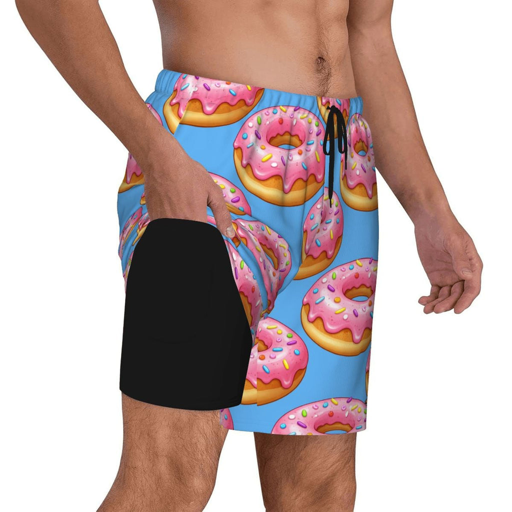 Person wearing a swimsuit with pink donut pattern on a blue background