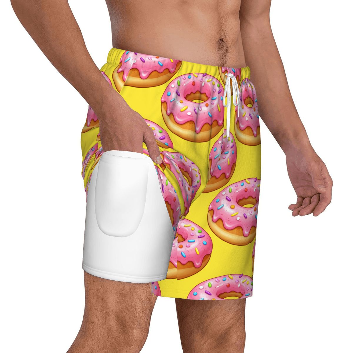 Yellow swim shorts with pink donut pattern worn by a person on a white background