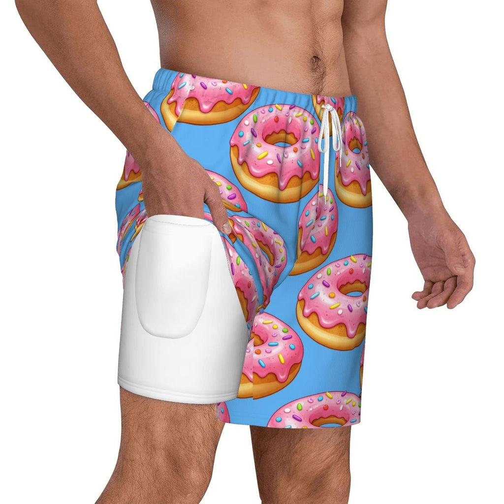 Person wearing a blue swimsuit with pink donut pattern on a white background
